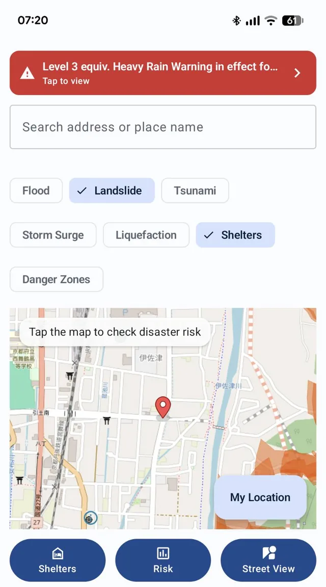 Map screen with an address search box, hazard layer toggles (Flood, Landslide, Tsunami, Storm Surge, Liquefaction, Shelters, Danger Zones), a map with a selected point, and a heavy rain warning banner at the top
