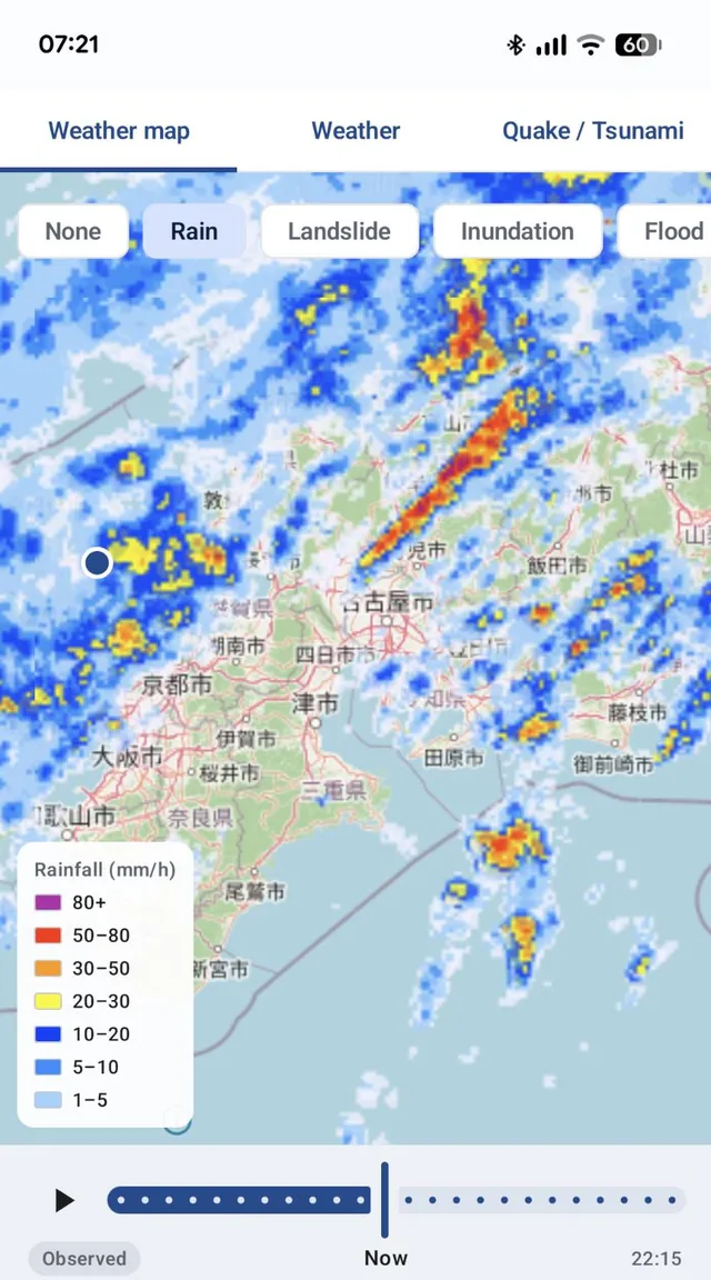 Weather map screen with layer buttons (None, Rain, Landslide, Inundation, Flood), a color-coded rainfall intensity map, and a timeline playback bar